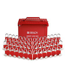 Front-facing view of a red portable group lockout box with 56 padlocks and 56 keys arranged in front of the box in a V formation. 