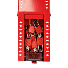Top view of a red portable group lockout box with the cover open and several lockout padlocks stored inside.